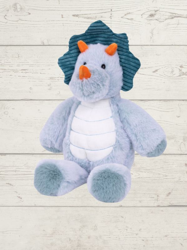 blue triceratops dinosaur soft toy on a wooden surface