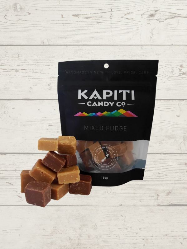 mixed fudge with packaging with Kapiti Candy co on it on a wooden surface