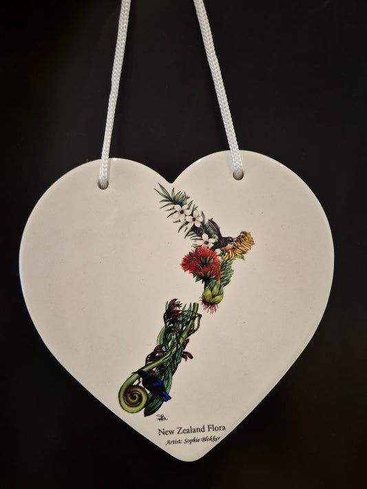 white heart on string with map of nz made with nz native foliage