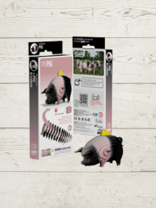 3d puzzle pig with packaging on a wooden surface
