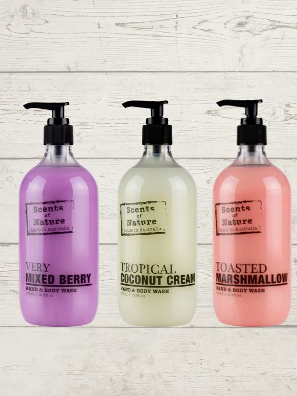Three pump bottles of Tilley Scent of Nature body wash in different scents, including Very Berry, Tropical Coconut Cream, and Toasted Marshmallow.