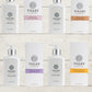 A collection of Tilley body wash bottles in various scents, including lavender, vanilla, and patchouli, with packaging that displays the scent name and minimalist design.