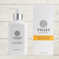 A collection of Tilley body wash bottles in various scents, including lavender, vanilla, and patchouli, with packaging that displays the scent name and minimalist design.