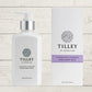 A collection of Tilley body wash bottles in various scents, including lavender, vanilla, and patchouli, with packaging that displays the scent name and minimalist design.