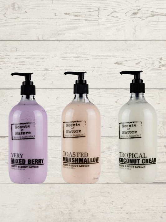 Three bottles of Tilley Scent of Nature body lotion with pump dispenser, in very mixed berry, toasted marshmallow, and tropical coconut cream flavors.