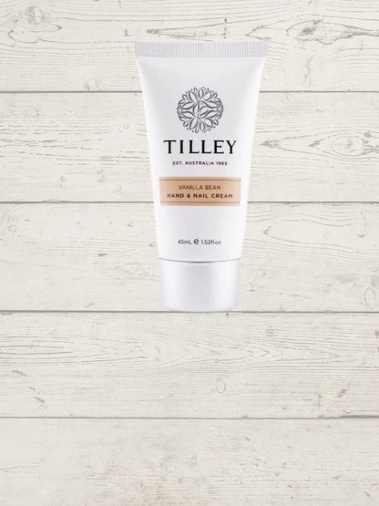 Tilley hand and nail cream tube on a wooden surface.