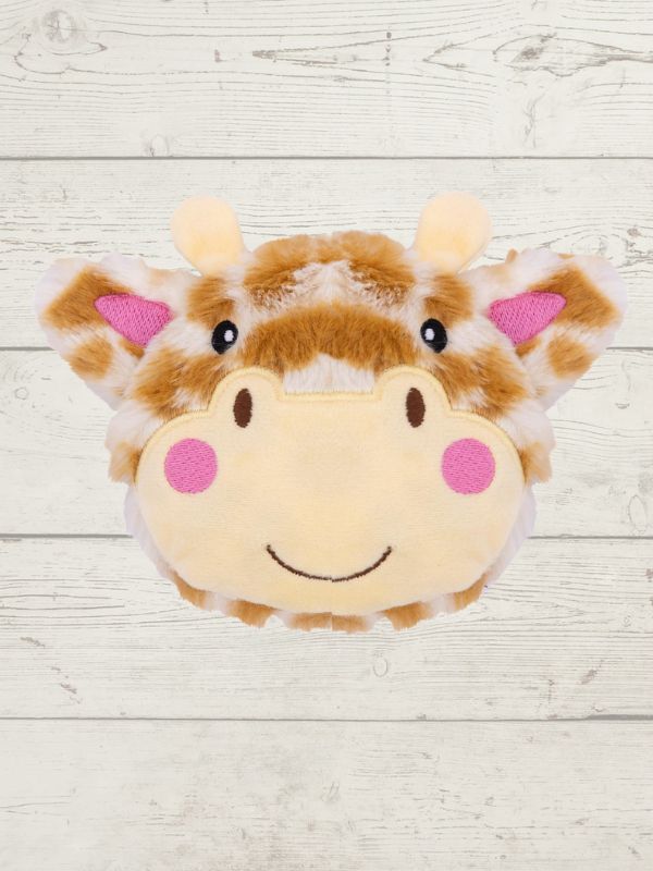 Plush giraffe toy with a smiling face on a light wooden background