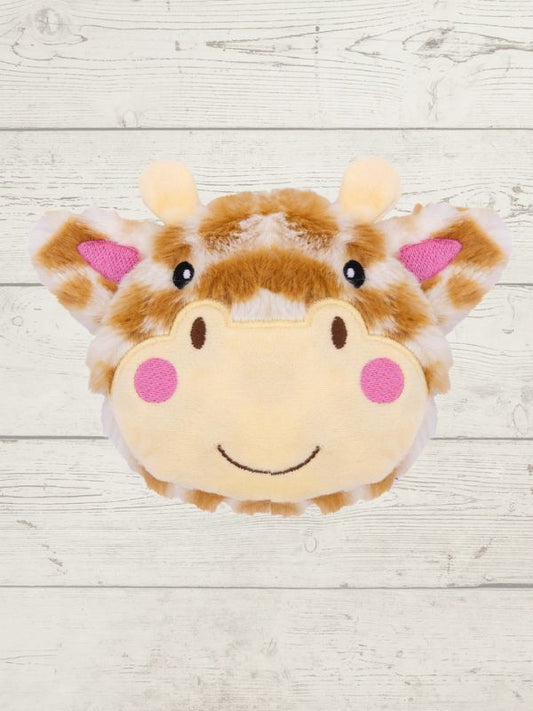 Plush giraffe toy with a smiling face on a light wooden background
