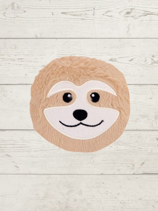 Round rug with a sloth face design on a light wooden floor.