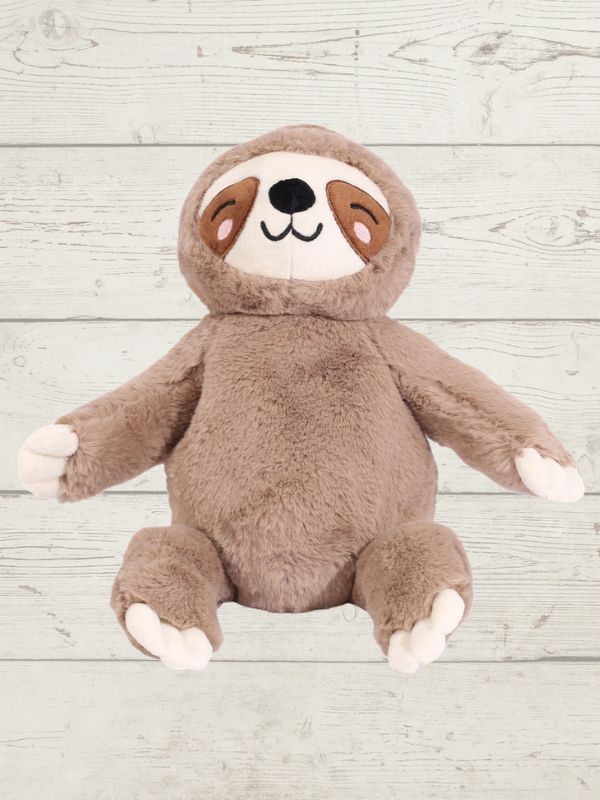 Plush toy sloth on a wooden surface