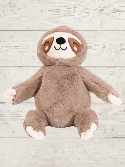 Plush toy sloth on a wooden surface