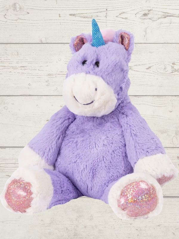 A plush toy resembling a marshmallow unicorn with a pink and purple color scheme, featuring embroidered details on the face and a fluffy texture.