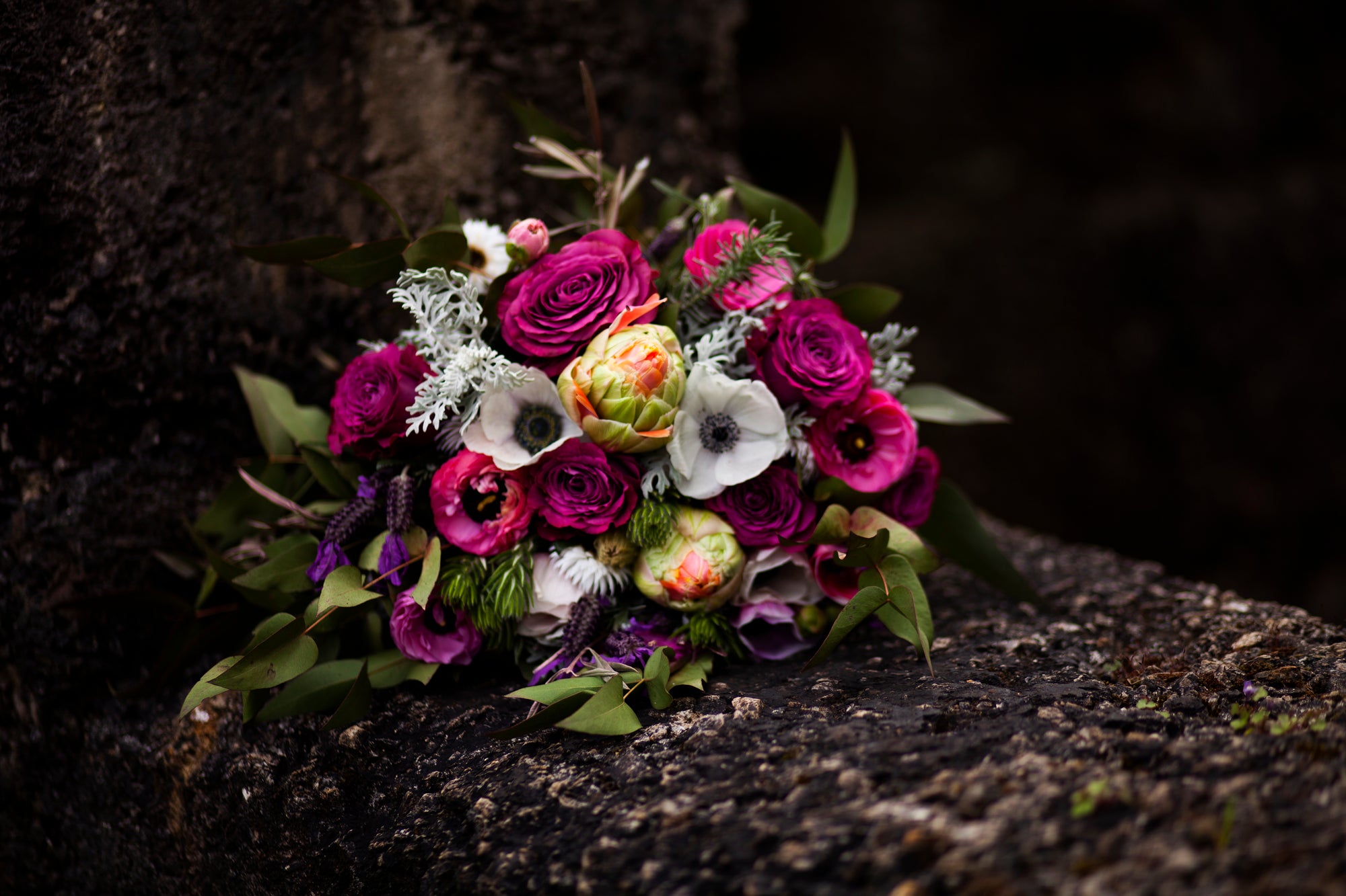 Colorful wedding flower bouquet on a dark background