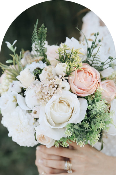 Wedding posy held by a bride 