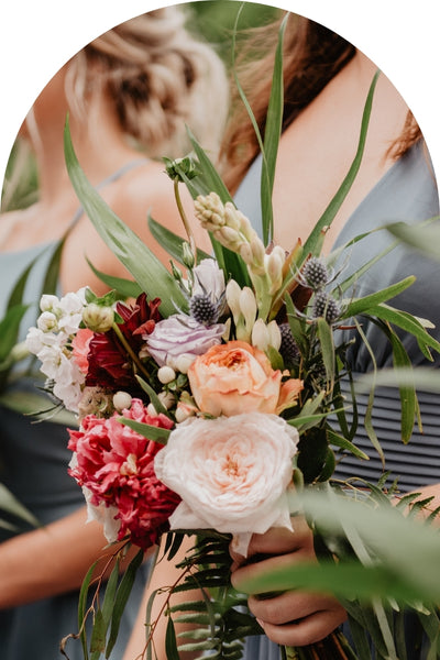 wedding posy being held by a bridesmaid