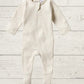 A long sleeve rib zipsuit for babies, with feet and fold-over mittens, in a gray color, displayed on a wooden background.