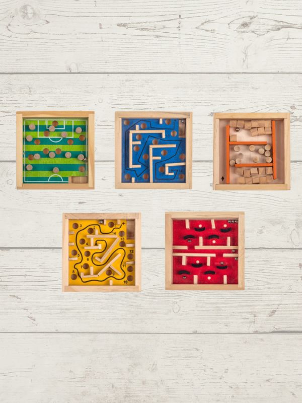 Five wooden maze toys in different colors on a light wooden surface