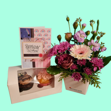 Petite arrangement with sweetness - This is a cute petite arrangement in a range of colours, a handmade card and 2 delicious cupcakes in our special flavour of the day